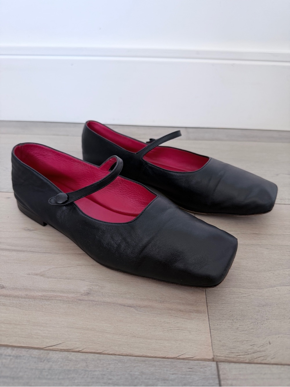 Mansur Gavriel Black Mary Jane Flats with red Interior and leather button.